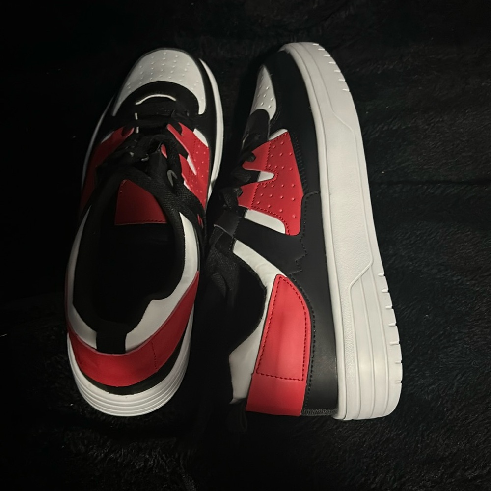the shoes are red black and white